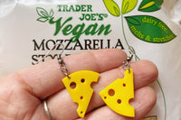 Colorful assortment of unique earrings including food and whimsical designs in the Monthly Earring Mania subscription box