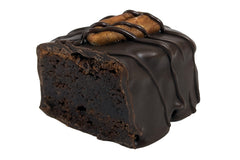 Close-up image of the Bourbon Brownie Bite. This is our classic brownie infused with bourbon, dipped in dark chocolate.