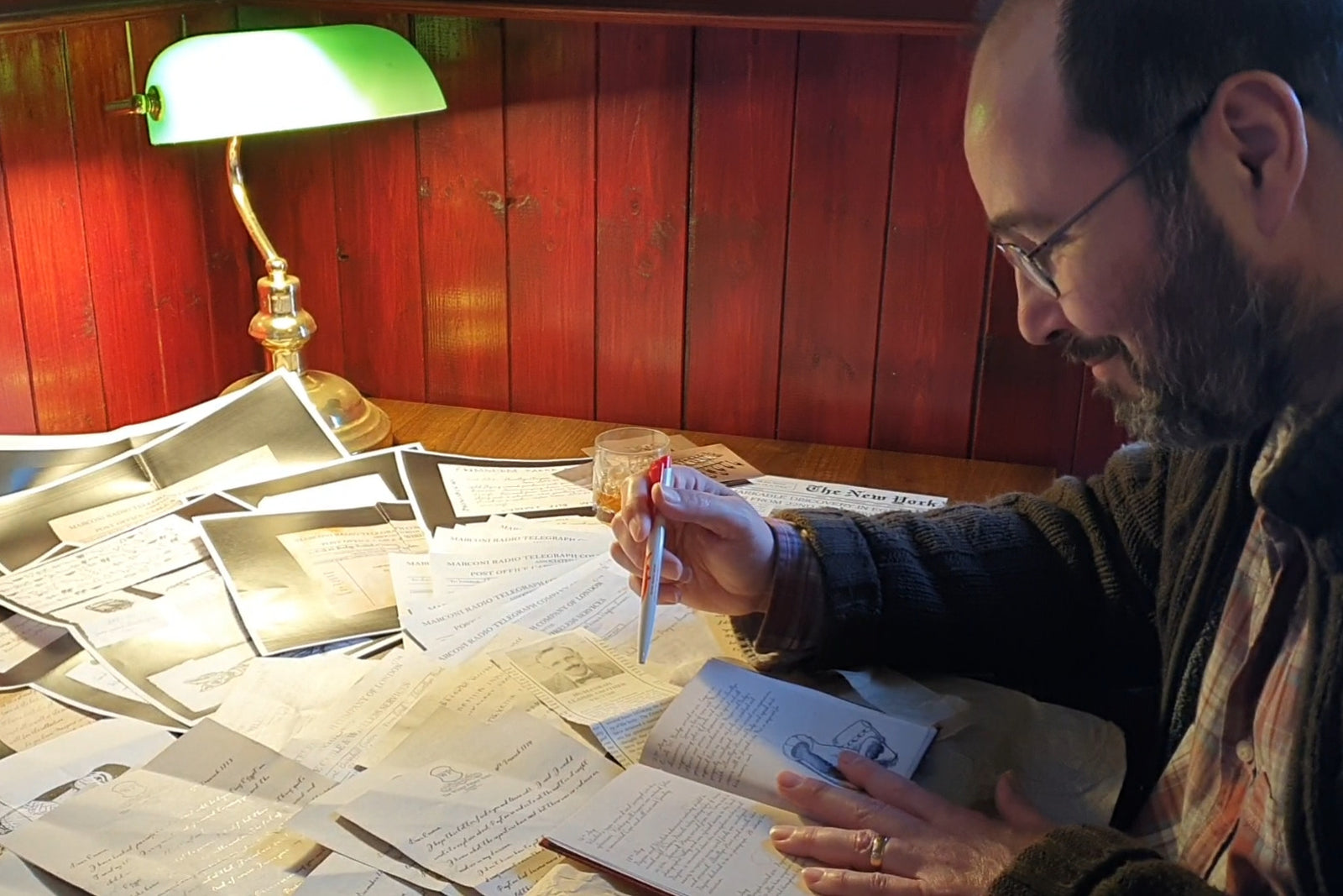 Father puzzles out the story, with a desk lamp and a scattering of documents revealed in boxes 1-3 of our second story The Curse of Humanra