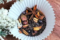 A shot of my Winter Trees tea in the middle with peeks of prop snowy tree branches above and to the left of it.