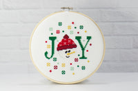 counted cross stitch of the month club for DIY crafting of snowman joy with colorful snowflakes for christmas decor