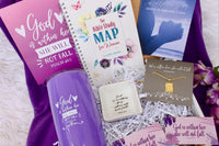 A cozy arrangement of fall-themed items in the Believer's Box VP, featuring socks, a candle, and a faith-inspired book