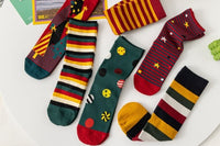 Old-fashioned Christmas stockings, featuring traditional holly and berries, evoke a sense of tradition and the time-honored customs 