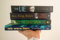 Brown subscription box filled with four young adult light reading books, featuring engaging stories and relatable characters for teen reader