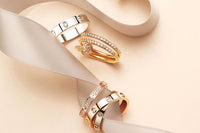4 Piece stackable Gold & White gold rings with cubic zirconia stones with each ring showcasing their own dainty minimalist style and design,