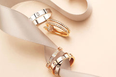 4 Piece stackable Gold & White gold rings with cubic zirconia stones with each ring showcasing their own dainty minimalist style and design,