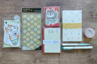 Packs by Misty Co. stationery subscription bundles with memo pad. sticker sheet, letter paper, message cards, writing paper, pens and tape.