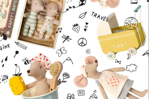 Items from a Why and Whale, including several stuffed mice and a pram and a bathtub.