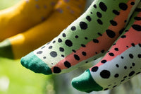 Cheeky Everyday socks included in Fall 23 box. With woven fish and outdoor prints, they are durable and stylish.