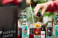 Cocktail subscription box from Cocktail Crates being enjoyed by a cocktail lover, making the negroni cocktail 