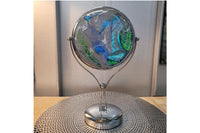 A vibrant green resin art piece with crystal accents, featured in The Joy of Resin Art subscription box