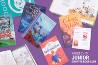 Two children reading books from Bookroo's Tween Book Club subscription on a colorful rug with additional books nearby