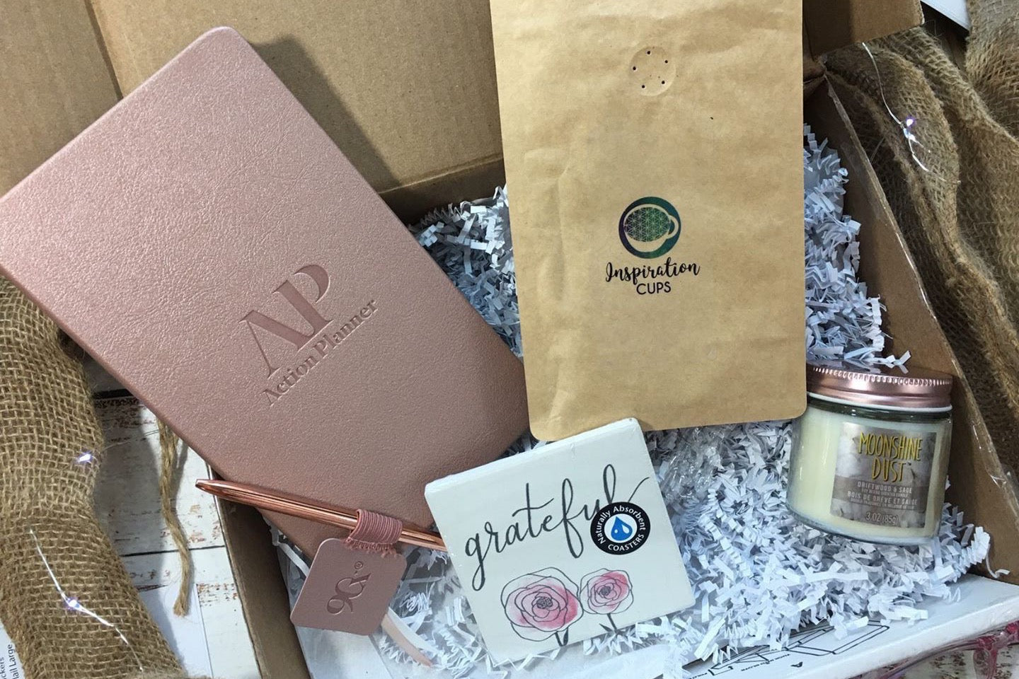 - ActionPlanner 
- 12oz Bag of Coffee 
- Coaster 
- Candle
- Pen 

*Items varies and theme changes. 