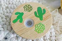 Mason jar snow globe glass can tumbler. Bamboo lid with green holographic vinyl cactus and succulents.