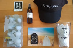 Items from a Bats and Bones subscription box, including a ghost ice tray, a ghost glass, a bracelet, a ghost baseball cap.