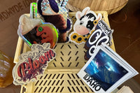 Example stickers with chrome Idaho Polaroid, pixie dust bloom, holographic crusted gecko, and regular certified OG.