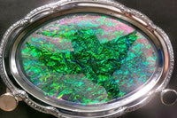 A vibrant green resin art piece with crystal accents, featured in The Joy of Resin Art subscription box