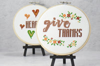 inspirational words give thanks on counted cross stitch monthly club pattern surrounded with colorful floral vines