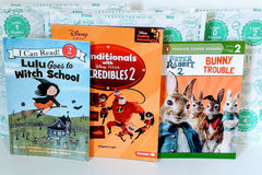 Three colorful children's books from the Kids Read Daily Book Club: "My Family and Me," "The Thrifty Guide to Ancient Rome," and "Freddie Mole, Lion Tamer"