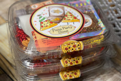 Three Pizza slime kits from Bored to Brilliant in clear deli containers with glitter and clay pieces, slime activator, jello powder.