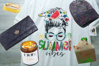 An Oliver Christopher's Boutique Box and other items on a table.