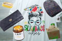 An Oliver Christopher's Boutique Box and other items on a table.