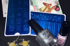 Nail stamping products- nail stamping plates, stamping polish, cuticle guard, and earrings for nail stamping subscription box My Mani Box.