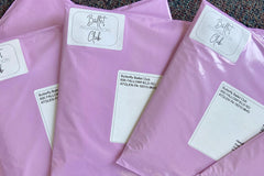 Ballet Kits in purple envelops. This ballet kit teaches dancers about ballet history and helps them set personal ballet goals.
