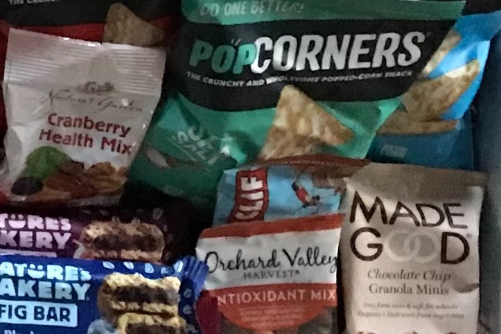 This box is filled with a bunch of different healthy snacks which will include Natures bakery bars, made good granola snacks along with a v.