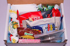 A Shark Week Survival Kit period subscription box featuring essential supplies for a comfortable and confident experience. 