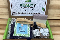 Beauty by Francesca Subscription Box with hair turban, hair conditioner, shampoo bar, lavender soap and bamboo comb.