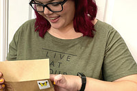 3-2-1 Stationery Subscription: This is a photo of one of our happy subscribers opening her stationery.
