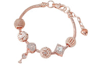 You will receive ONE of 5 different designs.  Rose gold toned Pandora style bracelet.  Fits up to a 7" wrist.