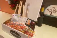 Enjoy a Paint and Sip Box or give as a gift. Each box contains an easel, a canvas, paint, a tray, and brushes. 