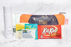 A Shark Week Survival Kit period subscription box featuring essential supplies for a comfortable and confident experience. 