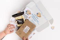 Read It & Eat Blind Date with a book.  Each box contains a food story, an artisanal snack, and a $5 donation to fight hunger in Buffalo, NY