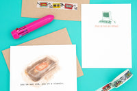 VHS tape greeting card, tape washi tape, not an email flat note card stationary, pen, envelope on a blue background. 