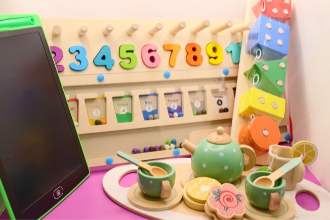 A collection of toys for toddlers that are all potential options for inclusion in the Toddler Toy Treasure Box.