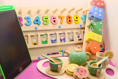 A collection of toys for toddlers that are all potential options for inclusion in the Toddler Toy Treasure Box.