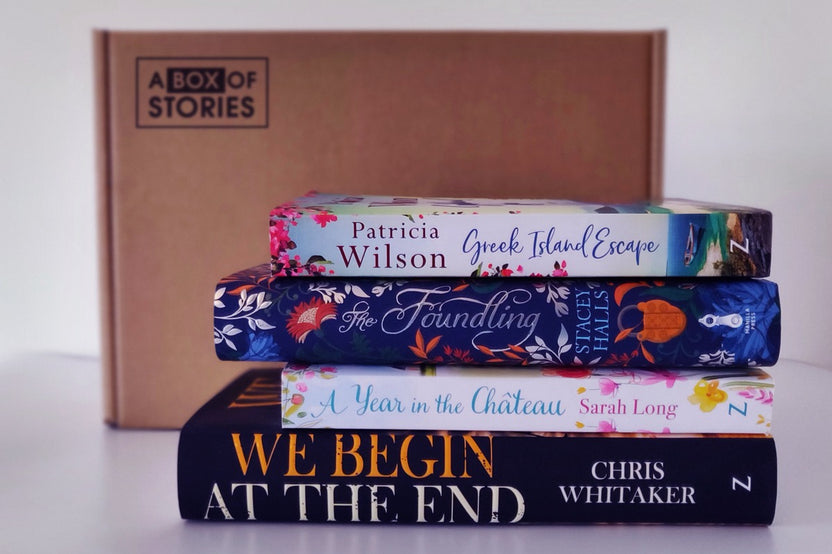 Brown subscription box filled with four surprise mystery books, featuring captivating stories and intriguing plots for genre enthusiasts.