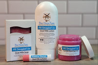 Picture showing a past subscription box . Goat milk soap, lotion, and sugar scrub in "All Snuggled Up" scent with a "Rainbow Sherbet" Lip