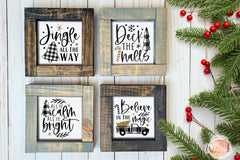 Brown and gray wood framed signs in various designs. Christmas jingle all the way, deck the halls, calm and bright.