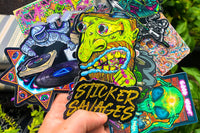 Colorful assortment of stickers from the Monthly Sticker Savages Box featuring monsters and whimsical designs for water bottle stickers