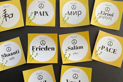 Peace stickers in various languages from the Cultural Geography Kits