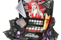 Gothic Beauty subscription box featuring magazine, goth-themed accessories, and spooky goodies arranged in a decorative package